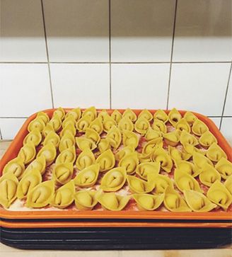 Trays of hand-folded tortellini ready for service